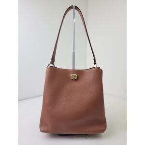 Coach Polished Pebble Leather Charlie Bucket Bag in Saddle